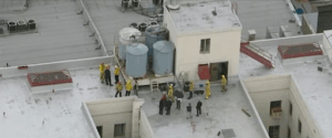 First responders on the roof near the water towers at the Cecil Hotel