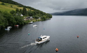 Modern day Nessie hunters on a boat out in Loch Ness.