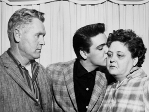 Elvis, his father Vernon and mother Gladys
