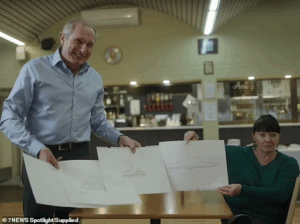 Former student Terry Peck showing images with reporter Ross Coulthart during a 60 minutes investigation into the event.