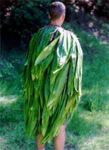 Ti leaves (kī) as a cape.