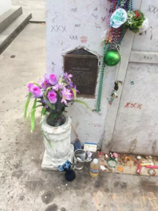 Offerings made at one of Marie Laveau’s tombs