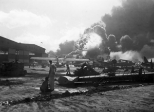Airmen watch as bombs explode at Pearl Harbor. Courtesy of Bettmann Archive/Getty Images and CNN via https://www.cnn.com/2022/12/07/us/gallery/pearl-harbor-attack