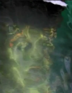 Ghostly face in the water captured by Susan De Vanny. Courtesy of AmericanGhostWalks.com via https://www.americanghostwalks.com/articles/pearl-harbor-ghosts