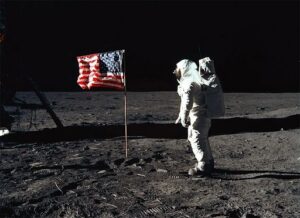 Buzz Aldrin standing next to the flag on the lunar surface. Courtesy of NASA and SkyAtNightMagazine.com