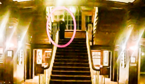 Henry Yao’s photo of a ghostly figure snapped at the landing of the Grand Staircase. Courtesy of ScarePop.com
